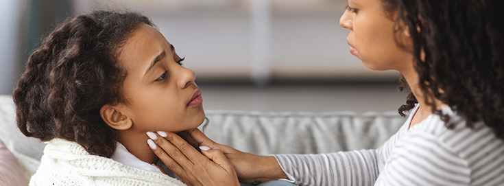 child sore throat symptoms in child resting at home